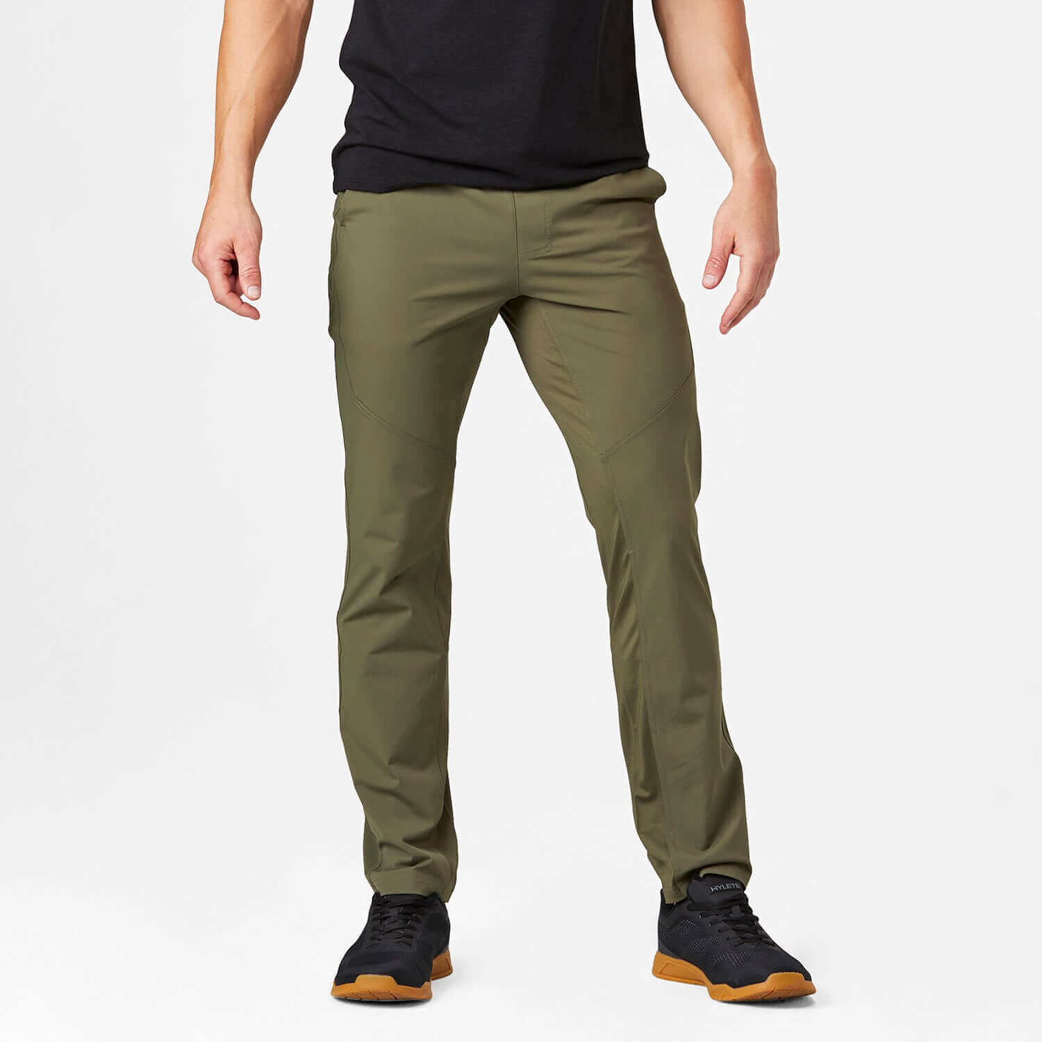 Man wearing Ion Pant in Olive, featuring a lightweight design and athletic cut for comfort and everyday style.